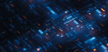 Auf einer Platine mit digitalen Schaltungen spiegelt sich das Licht.